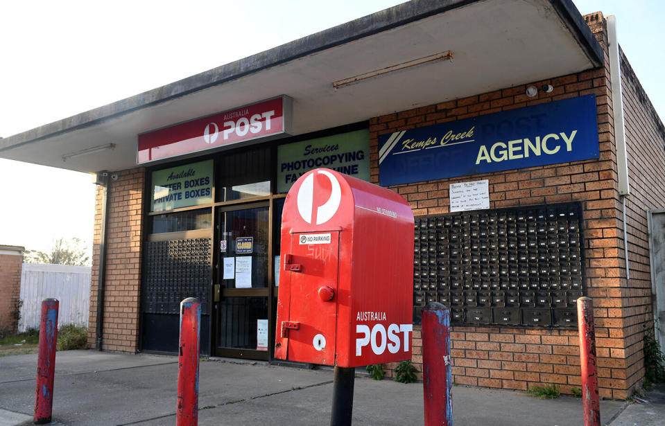 Instead of having their items delivered, red cards have been left for the customers to take to the post office to collect their package themselves, dozens claim. Source: AAP/Brendan Esposito, file