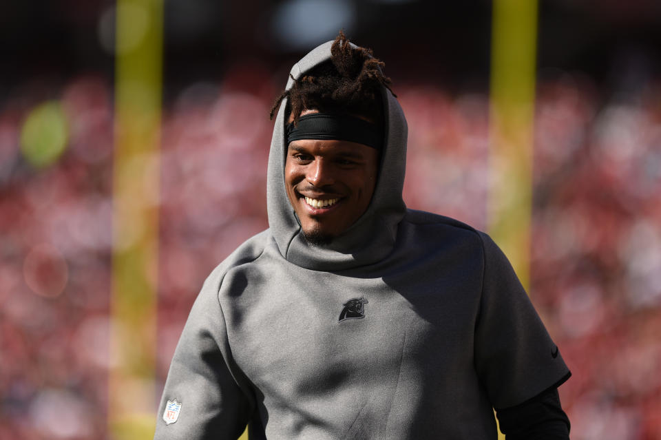 He may be injured, but Cam Newton still played Santa for Charlotte schools on Tuesday. (Cody Glenn/Icon Sportswire)