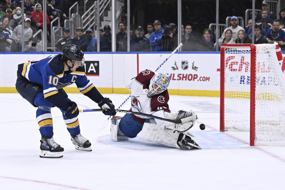 St. Louis Blues' Brayden Schenn (10) misses on a shot against Colorado Avalanche's Alexandar Georgiev (40) during the second period of an NHL hockey game Wednesday, Dec. 29, 2023, in St. Louis. (AP Photo/Michael Thomas)