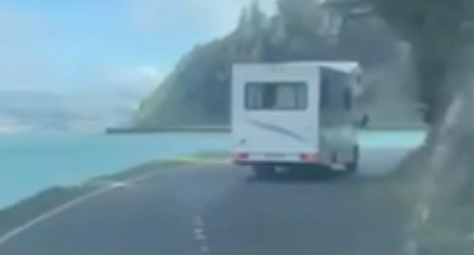 The campervan's heart-stopping moment can be seen with the vehicle visibly over the road's centreline as it approached a blind corner. 