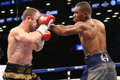 Daniel Jacobs (right) lands a left jab on Jarrod Fletcher during his WBA middleweight title defense in August 2014. (Getty)