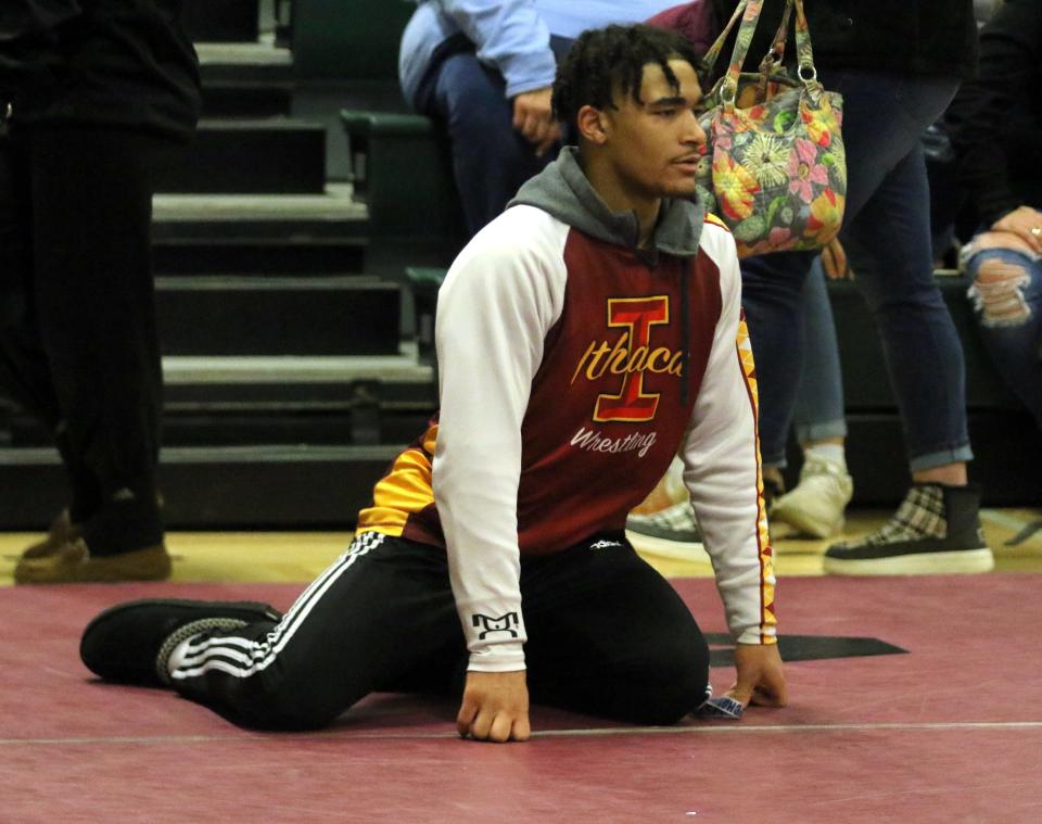 Ithaca's Daniel Parker in the corner of 118-pound teammate Caleb Cole during the Dave Buck Memorial Wrestling Tournament at Elmira High School on Dec. 10, 2022. Parker won the 160-pound title.