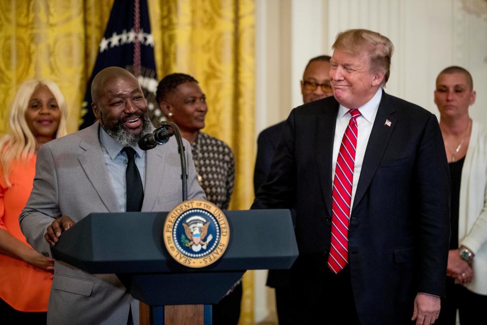 Matthew Charles, a First Step Act beneficiary, left, accompanied by President Donald Trump, speaks at the 2019 Prison Reform Summit and First Step Act Celebration in 2019.