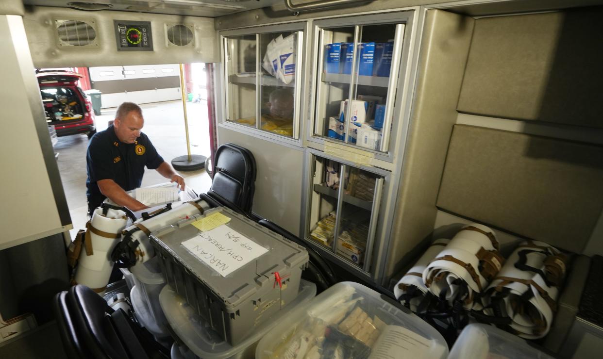 Columbus Division of Fire Capt. Aaron Renner looks through a box of medical supplies Tuesday inside the special mass casualty ambulance, which is kept in Downtown Fire Station #1.