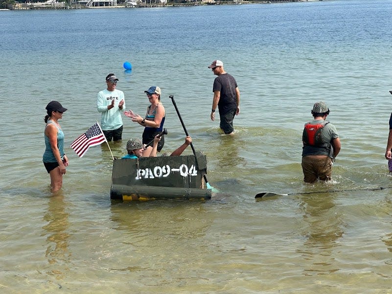 Three students created a cardboard replica of the Higgins Boat used in the D-Day landings.