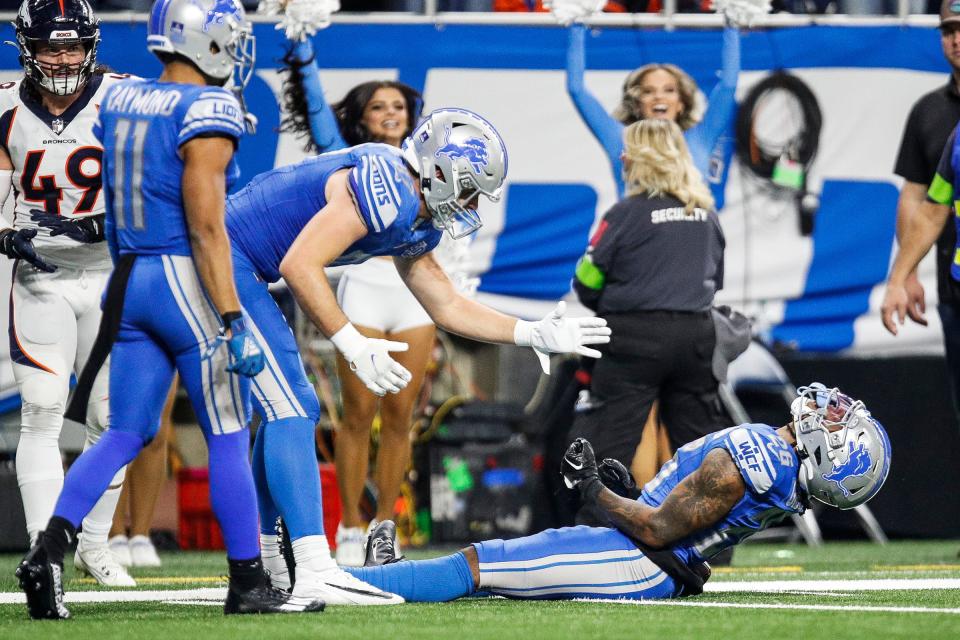 Detroit Lions running back Jahmyr Gibbs (26) celebrates a play against the Denver Broncos during the second half at Ford Field in Detroit on Saturday, Dec. 16, 2023.