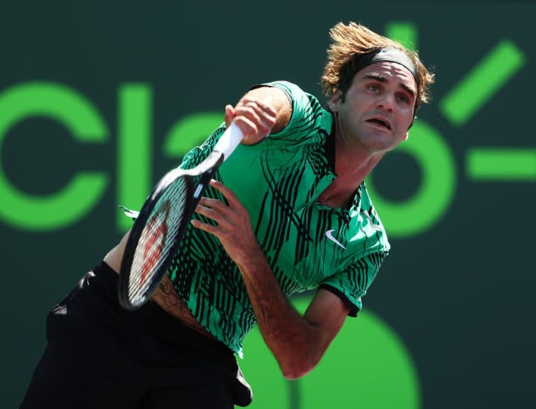 Roger Federer of Switzerland servest against Juan Martin Del Potro of Argentina during their Miami Open 3rd round match, at Crandon Park Tennis Center in Key Biscayne, Florida, on March 27, 2017