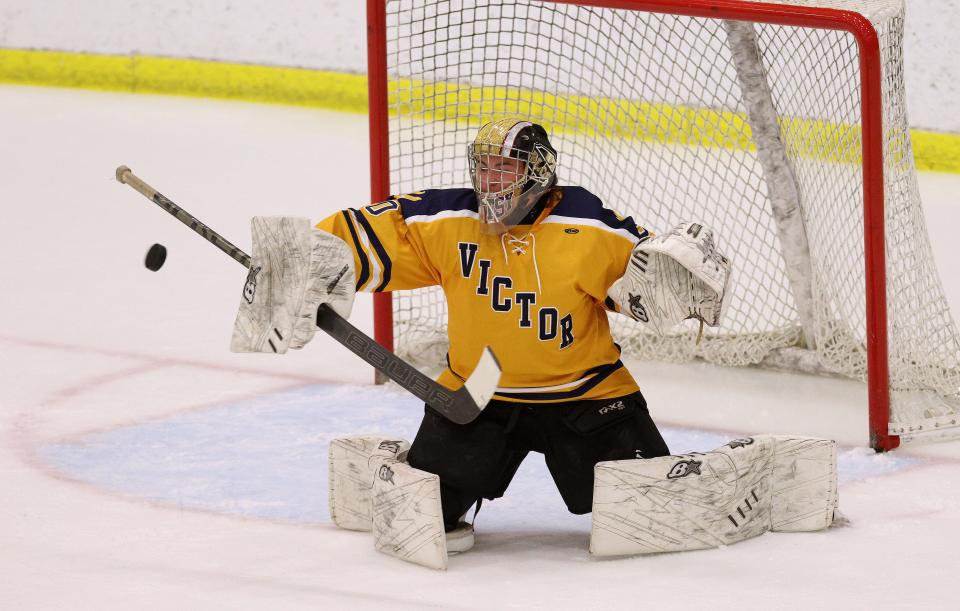 Victor goalie Max Pitts makes a save against Penfeld in the Class A final. 