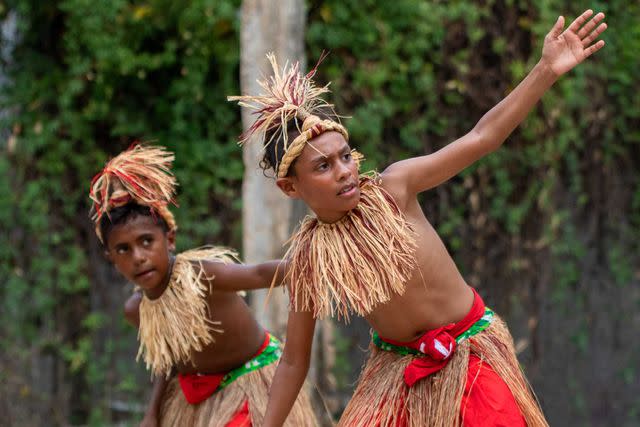 <p>Courtesy of Tourism & Events Queensland and Strait Experience</p> Young Torres Strait Islanders perform a traditional dance.