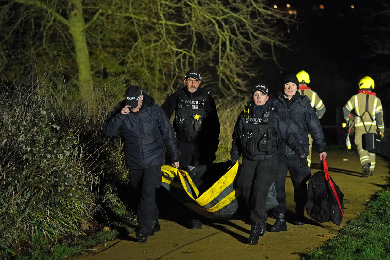 Emergency personnel at the scene in Babbs Mill Park in Kingshurst, Solihull after a serious incident where several people are believed to be in a critical condition after being pulled from the lake. Picture date: Sunday December 11, 2022.