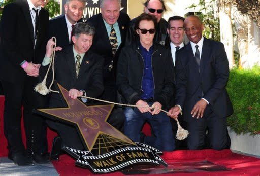 Music legend Paul McCartney watches as his star on the Hollywood Walk of Fame is unveiled. Receiving the 2,460th Star on the famed walkways of Hollywood, McCartney's star is lined up alongside his fellow Beatles, John Lennon, George Harrison and Ringo Starr