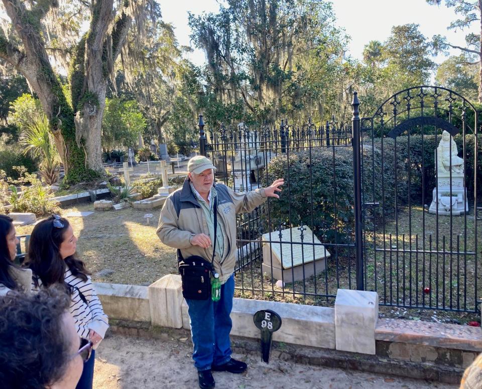 Don Teuton shares some of the history of Little Gracie, explaining that visitors leave many toys for her at the grave site, which volunteers collect and donate to the Ronald McDonald House.