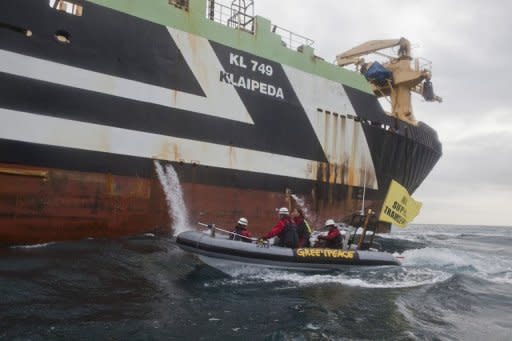 Image provided by Greenpeace shows activists on an inflatable boat blocking Dutch super-trawler FV Margiris' attempt to enter Port Lincoln in South Australia on August 30. The trawler's operators would have to prove they were doing everything necessary to minimise by-catch