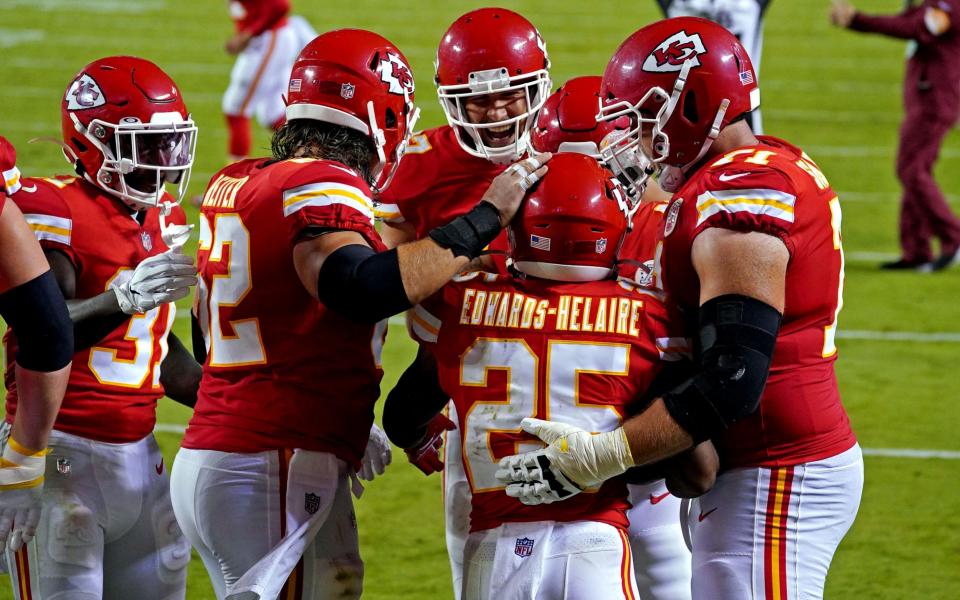 Kansas City Chiefs running back Clyde Edwards-Helaire (25) celebrates scoring a touchdown during the second half against the Houston Texans at Arrowhead Stadium.  - Denny Medley-USA TODAY Sports