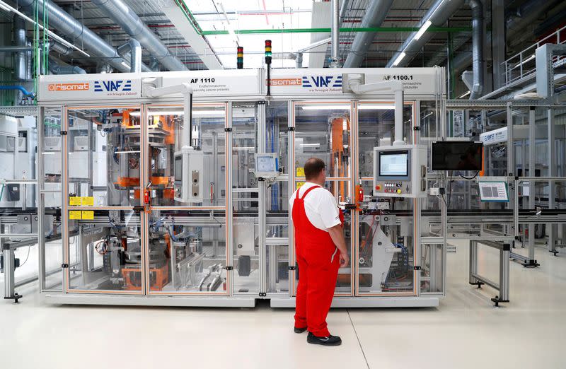 FILE PHOTO: A worker checks the screen at the Audi Factory in Gyor