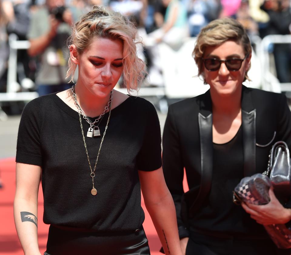 US actress Kristen Stewart (L) and US visual effects producer Alicia Cargile arrive on May 15, 2016 for the screening of the film "American Honey" at the 69th Cannes Film Festival in Cannes, southern France.  / AFP PHOTO / ALBERTO PIZZOLI        (Photo credit should read ALBERTO PIZZOLI/AFP via Getty Images)