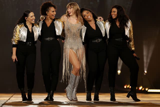 <p>Ashok Kumar/TAS24/Getty</p> Taylor Swift and some of her backup singers in Singapore