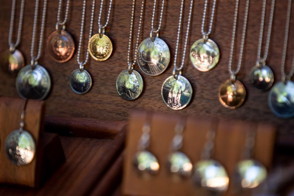 Jessie Driscoll with Made from Coins has his custom jewelry on display at the 2021 St. James Court Art Show. Oct. 1, 2021