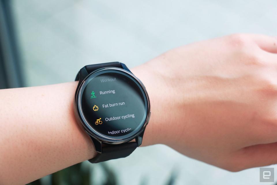 <p>OnePlus Watch review photos. OnePlus Watch on a wrist showing a list of workouts including Running, Fat Burn Run, Outdoor cycling and Indoor cycling.</p>
