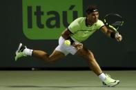 Mar 29, 2017; Miami, FL, USA; Rafael Nadal of Spain reaches for a forehand against Jack Sock of the United States (not pictured) on day nine of the 2017 Miami Open at Crandon Park Tennis Center. Nadal won 6-2, 6-3. Mandatory Credit: Geoff Burke-USA TODAY Sports