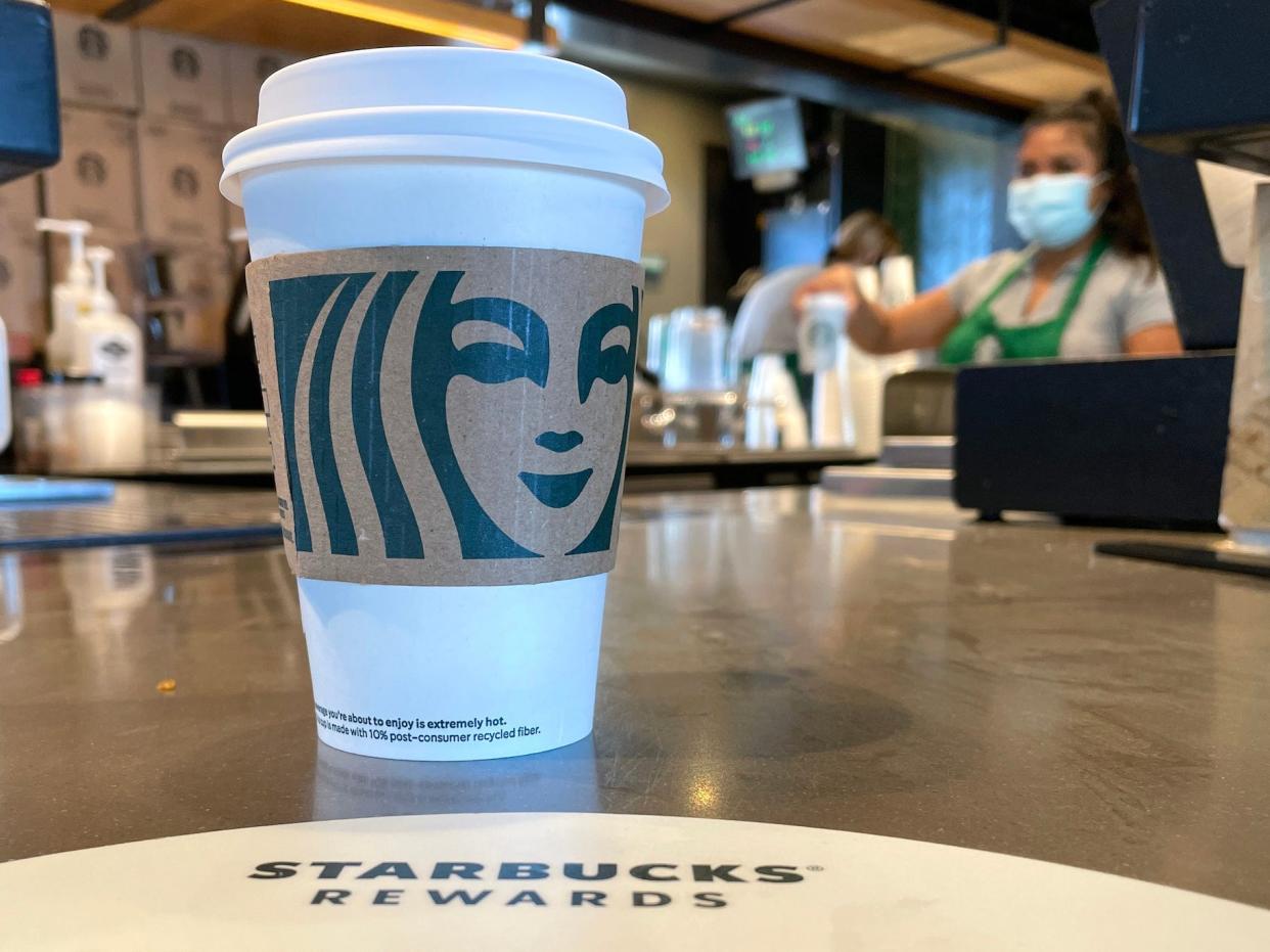 The Starbucks logo is displayed on a cup at a Starbucks store on October 29, 2021 in Marin City, California.