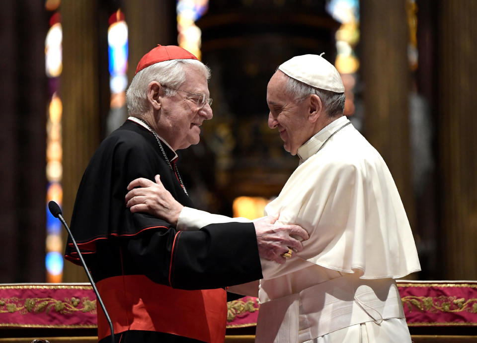 Pope Francis hugs Cardinal Angelo Scola, left, inside Milan’s Duomo Cathedral at a meeting with members of the Catholic Church, as part of his one-day pastoral visit to Monza and Milan, Italy’s second-largest city, Saturday, March 25, 2017. Pope Francis began his one-day visit Saturday to the world's largest diocese which included a stop at the city's main prison as well as a blessing at the Gothic-era Duomo cathedral. (L'Osservatore Romano/Pool Photo via AP)