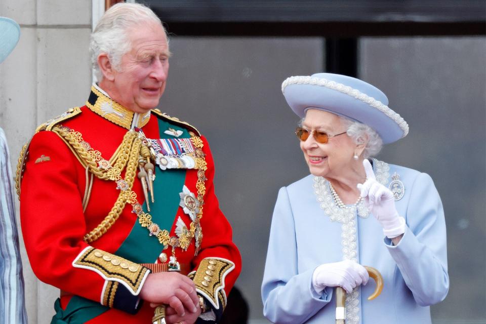 LONDON, UNITED KINGDOM - JUNE 02: (EMBARGOED FOR PUBLICATION IN UK NEWSPAPERS UNTIL 24 HOURS AFTER CREATE DATE AND TIME) Prince Charles, Prince of Wales (wearing the uniform of Colonel of the Welsh Guards) and Queen Elizabeth II watch a flypast from the balcony of Buckingham Palace during Trooping the Colour on June 2, 2022 in London, England. Trooping The Colour, also known as The Queen's Birthday Parade, is a military ceremony performed by regiments of the British Army that has taken place since the mid-17th century. It marks the official birthday of the British Sovereign. This year, from June 2 to June 5, 2022, there is the added celebration of the Platinum Jubilee of Elizabeth II in the UK and Commonwealth to mark the 70th anniversary of her accession to the throne on 6 February 1952. (Photo by Max Mumby/Indigo/Getty Images)