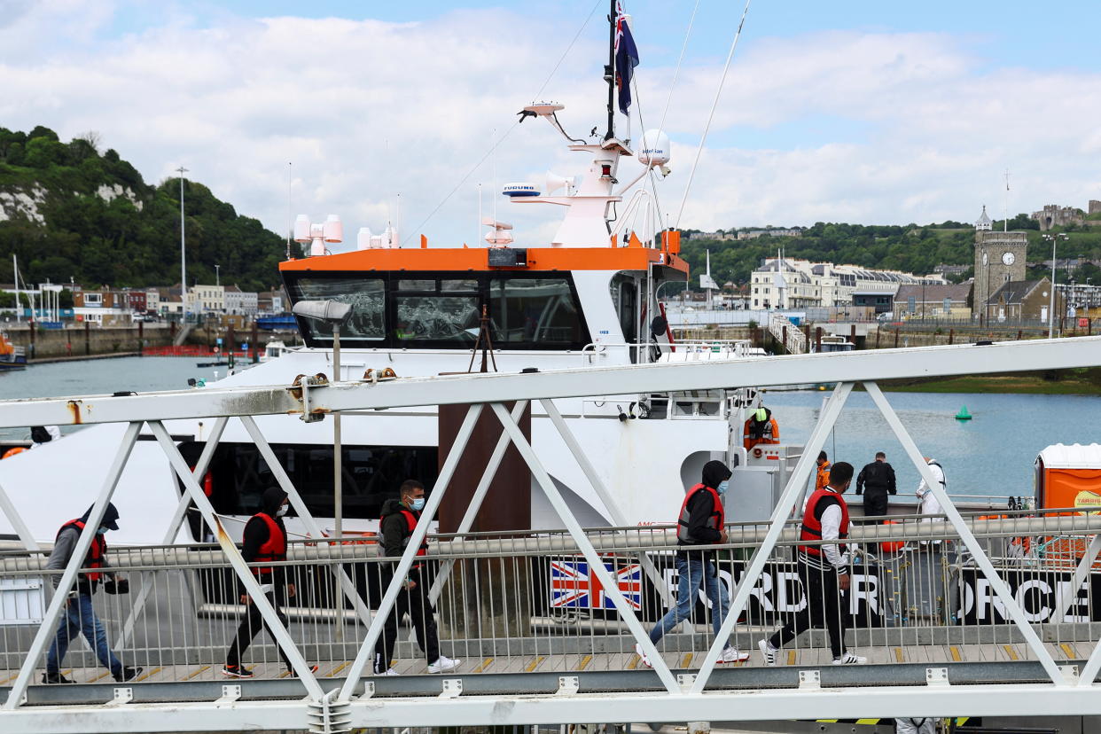 Migrants arrive at the Port of Dover, after being rescued while crossing the English Channel, in Dover, Britain, June 13, 2022. REUTERS/Hannah McKay