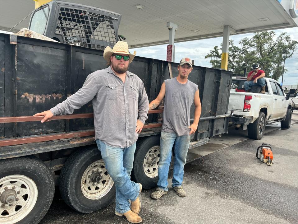 Texas brothers Trey and Chris Athey plan to ride out Hurricane Idalia in a white Chevrolet pickup truck. As of 6 p.m., on Aug. 29, 2023, they were parked in a Cross City gas station, but they'll move if the hurricane projections do.