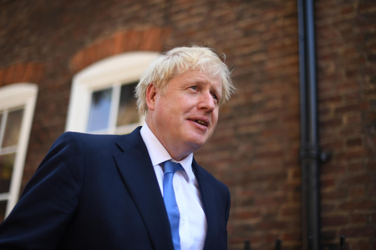 Newly elected leader of the Conservative party Boris Johnson leaves his office in Westminster, London, after it was announced he had won the leadership ballot and will become the next Prime Minister.