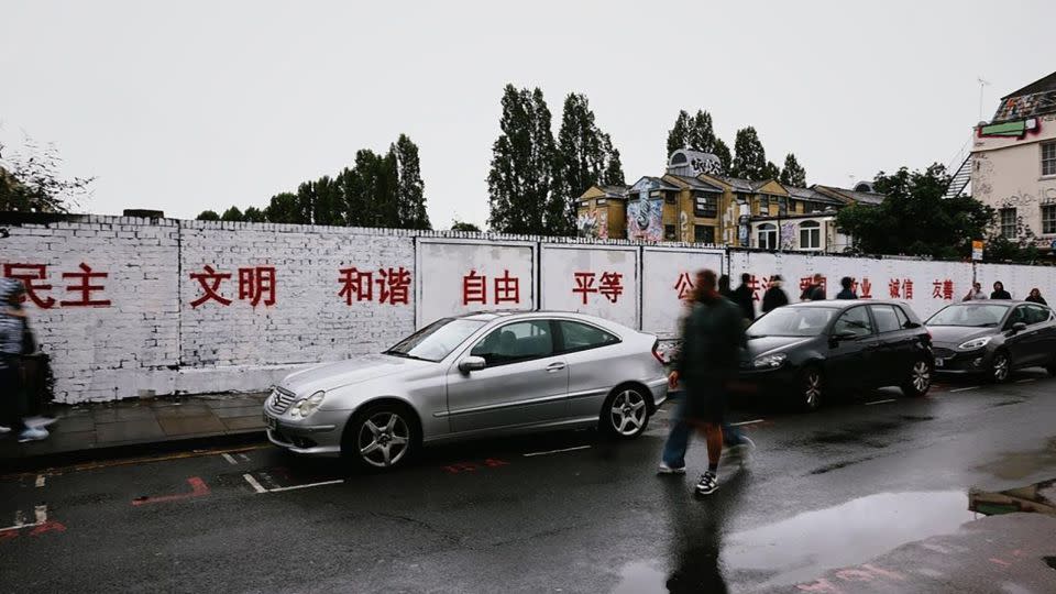 A grafitti wall in Brick Lane was whitewashed and painted over with red slogans promoting China's "core socialist values." - @yiqueart/Instagram