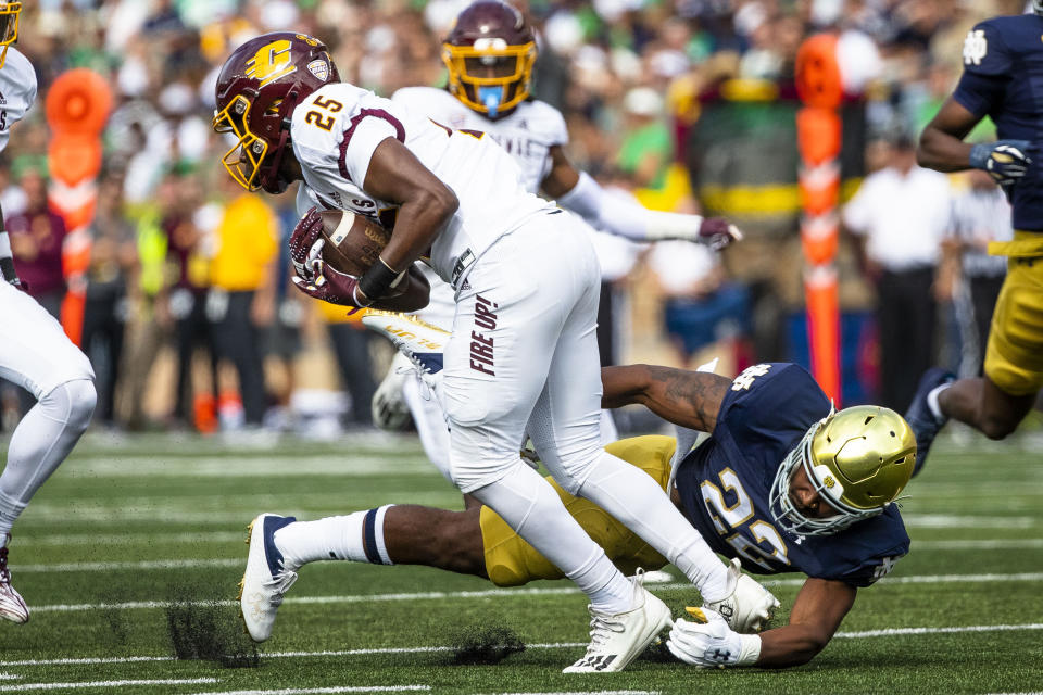 Notre Dame's Devyn Ford (22) tackles Central Michigan's Javorian Wimberly (25) on a punt return during the first half of an NCAA college football game on Saturday, Sept. 16, 2023, in South Bend, Ind. (AP Photo/Michael Caterina)
