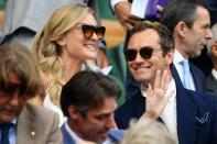 British actor Jude Law (R) and wife Phillipa Coan (L) are seen in the Royal Box above Centre Court before the start of the men's singles semi-final match between Serbia's Novak Djokovic and Spain's Roberto Bautista Agut on day 11 of the 2019 Wimbledon Championships at The All England Lawn Tennis Club in Wimbledon, southwest London, on July 12, 2019. (Photo by Daniel LEAL-OLIVAS / AFP) / RESTRICTED TO EDITORIAL USE (Photo credit should read DANIEL LEAL-OLIVAS/AFP via Getty Images)