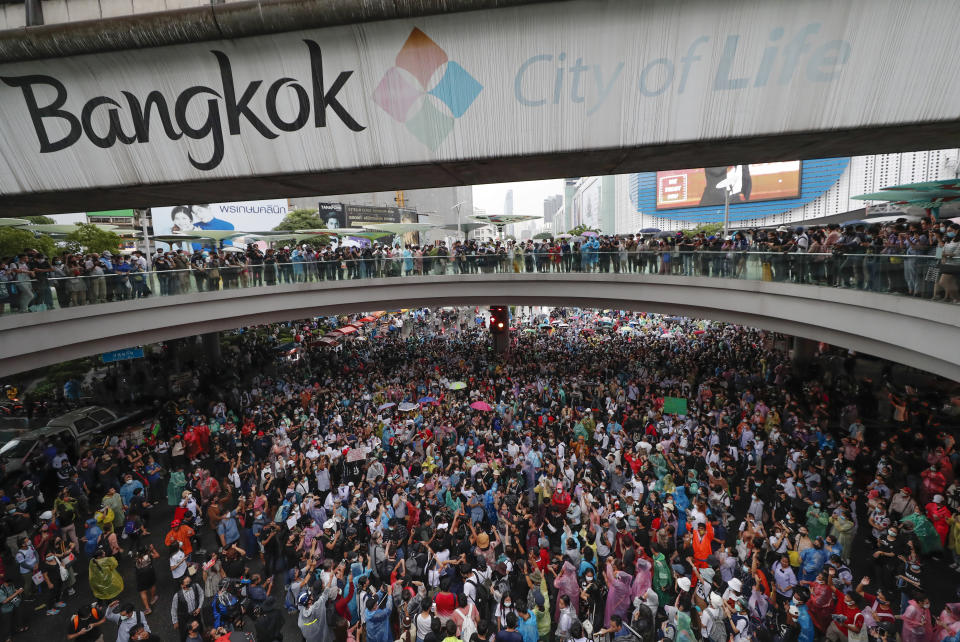 Pro-democracy demonstrators gather in an intersection of a business district in Bangkok, Thailand, Friday, Oct. 16, 2020. Thailand’s prime minister has rejected calls for his resignation as his government steps up efforts to stop student-led protesters from rallying in the capital for a second day in defiance of a strict state of emergency. (AP Photo/Sakchai Lalit)