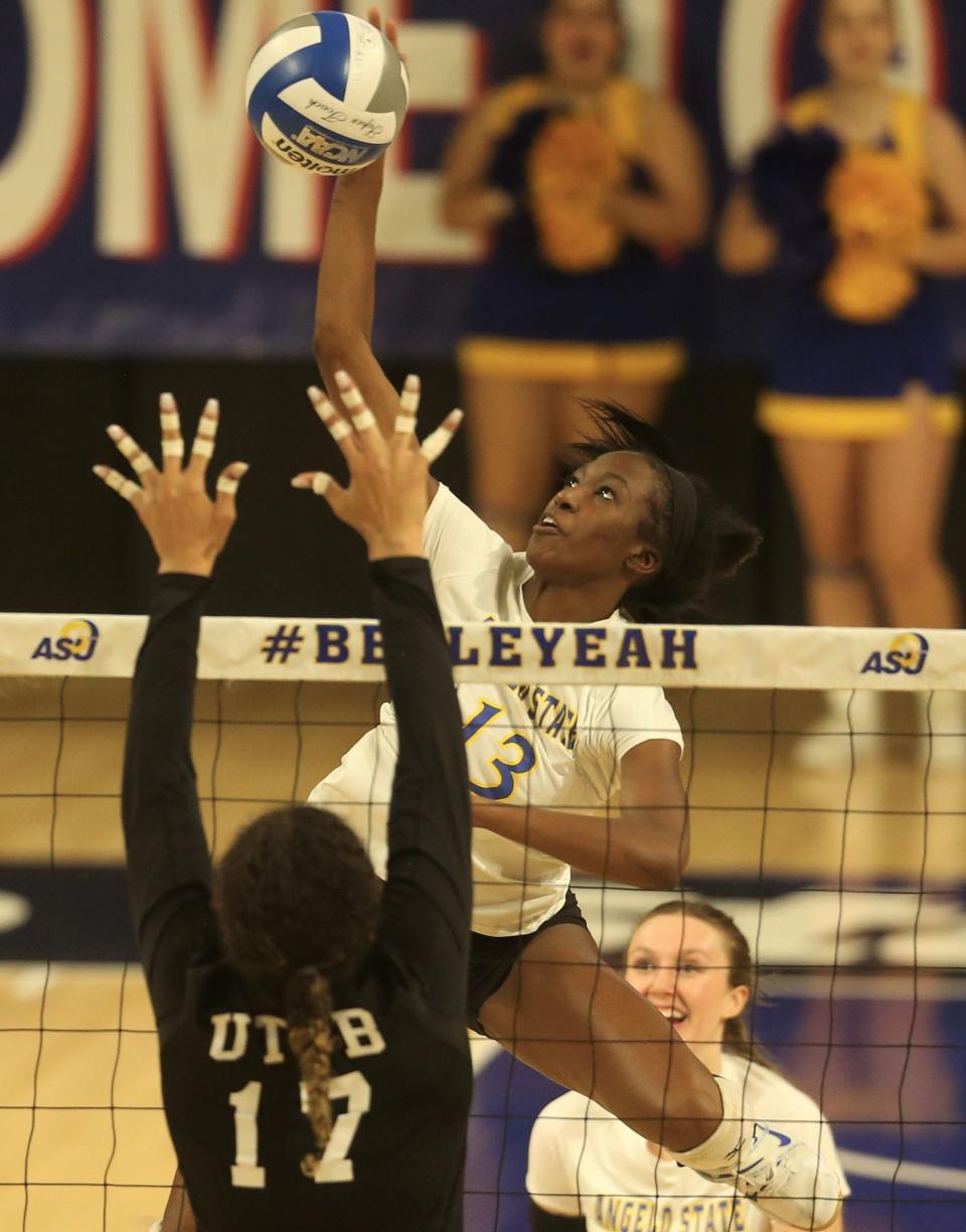 Angelo State University's Grace White (13) goes up for an attack against UT Permian Basin in a Lone Star Conference Tournament quarterfinal at the Junell Center on Thursday, Nov. 18, 2021.