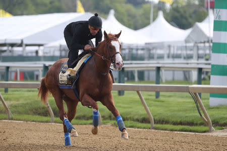 FILE PHOTO: May 16, 2019; Baltimore, MD, USA; Improbable participates in a morning workout at Pimlico Race Course. Mandatory Credit: Mitch Stringer-USA TODAY Sports/File Photo