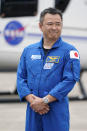 SpaceX Crew 2 member, Japan Aerospace Exploration Agency astronaut Akihiko Hoshide smiles as he arrives at the Kennedy Space Center in Cape Canaveral, Fla., Friday, April 16, 2021. The launch to the International Space Station is targeted for April 22. (AP Photo/John Raoux)