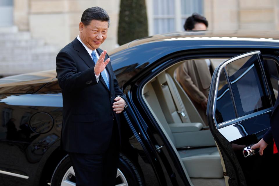 Chinese President Xi Jinping enters his car after a visit at the Elysee presidential palace in Paris
