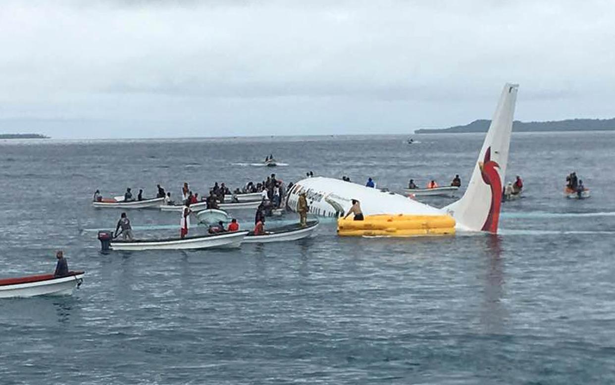 The Boeing 737-800 pictured here floating in a shallow lagoon - reuters