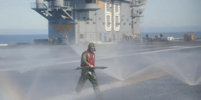 Washing down on the flight deck of the aircraft carrier USS Nimitz