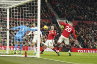 Manchester United's goalkeeper David de Gea makes a save during the English Premier League soccer match between Manchester United and Leeds United at Old Trafford in Manchester, England, Wednesday, Feb. 8, 2023. (AP Photo/Dave Thompson)