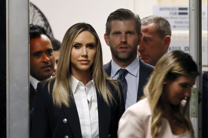 Republican National Committee Co-Chair Lara Trump (CL) and husband Eric Trump (M) return to the Manhattan courtroom after a break during former President Donald Trump's criminal trial in New York on Tuesday. Pool photo by Michael M. Santiago/UPI