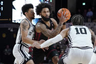 Temple's Damian Dunn, center, drives against Vanderbilt's Scotty Pippen Jr., left, and Myles Stute (10) during the first half of an NCAA college basketball game Tuesday, Dec. 7, 2021, in Nashville, Tenn. (AP Photo/Mark Humphrey)