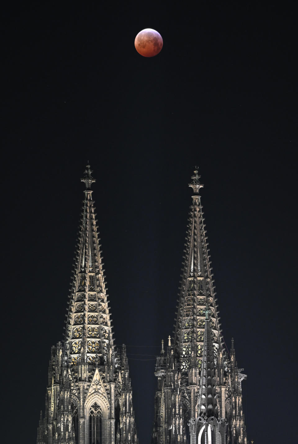 The super blood moon above a cathedral in Cologne, Germany, Jan. 21.