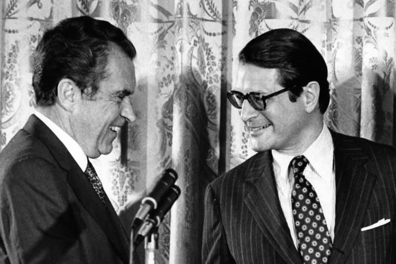 President Richard Nixon congratulates Elliot Richardson after he is sworn in as attorney general at the White House on May 25, 1973. Richardson resigned October 20, 1973, after Nixon ordered him to fire special prosecutor Archibald Cox. File Photo by Byron Schumaker/White House