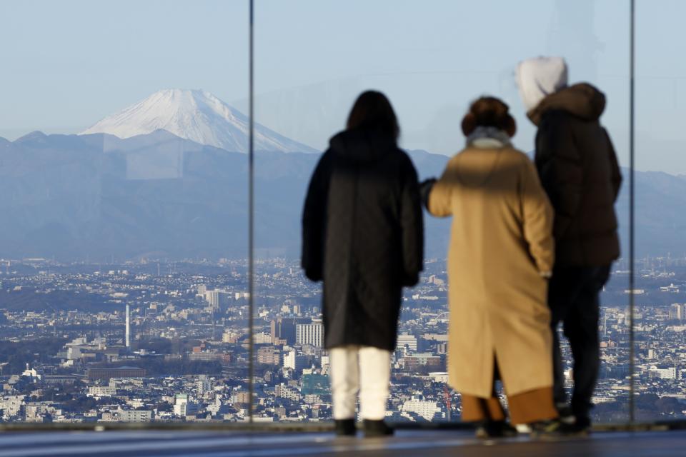Mt. Fuji, left, seen from the Shibuya Sky observation deck in Tokyo. Photographer: Kiyoshi Ota/Bloomberg