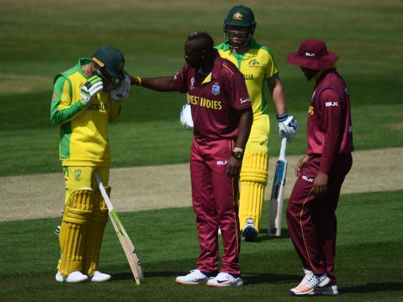 Usman Khawaja was struck by a ball from Andre Russell (Getty)