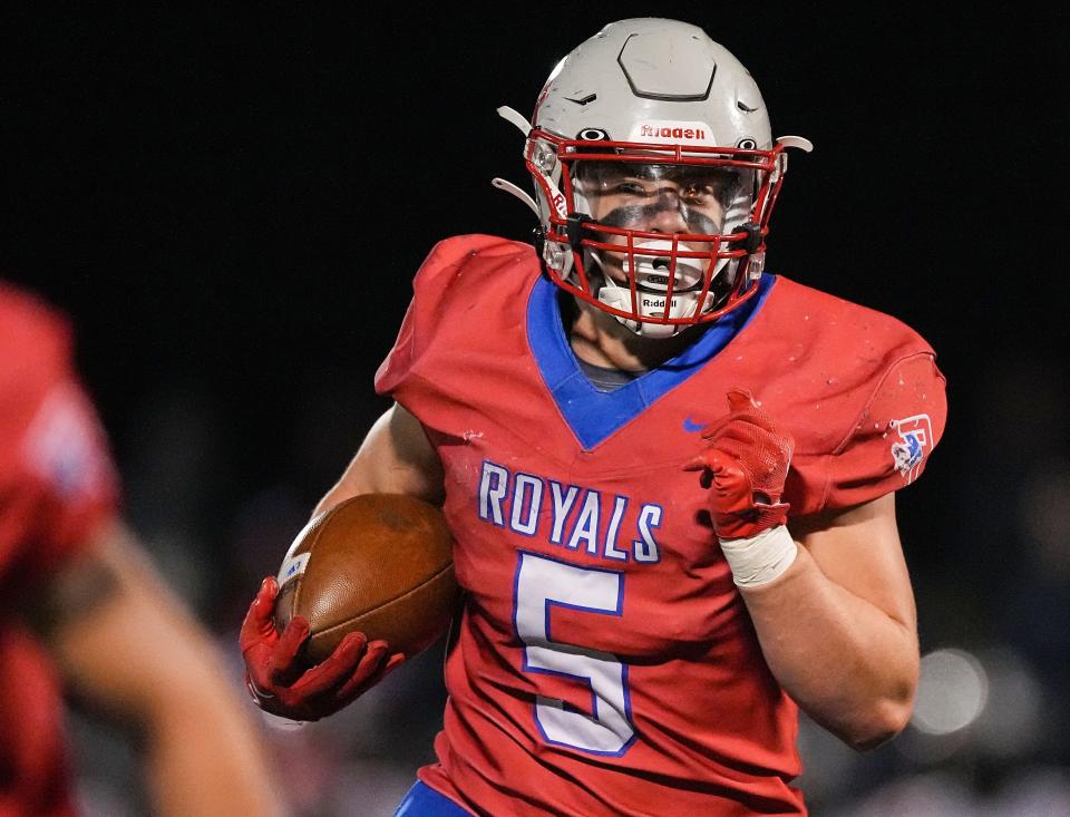 Roncalli Royals running back Luke Hansen (5) rushes the ball up the field Friday, Nov 11, 2022 at Roncalli High School in Indianapolis. The Roncalli Royals defeated the New Palestine Dragons, 20-7, for the IHSAA Class 4A regional championship. 