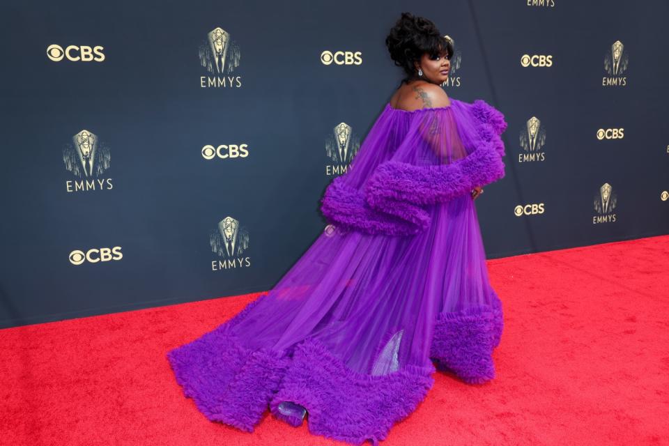 Nicole Byer in a flowing diaphanous purple dress