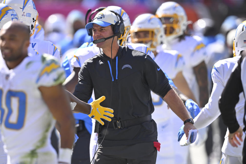 Los Angeles Chargers head coach Brandon Staley celebrates with the team after the they scored a touchdown against the Cleveland Browns during the first half of an NFL football game, Sunday, Oct. 9, 2022, in Cleveland. (AP Photo/David Richard)